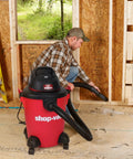 Person using Heavy Duty 6 Gallon Wet Dry Vacuum With 3.0 Peak HP, 3 In 1 Function, in a workshop setting.