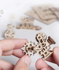Self Assembly Tribiks Anti Stress Wooden Mechanical Models Kit For Adults And Kids Five And Up Four Miniature Models Desk Toy For Stress Relief Creative Wood Craft Set That Sparks Focus And Fun, wooden gear model in hand