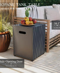 Propane tank table with side-opening door next to outdoor sofa on patio, plants in background