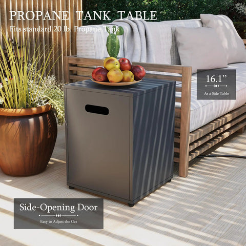 Propane tank table with side-opening door next to outdoor sofa on patio, plants in background