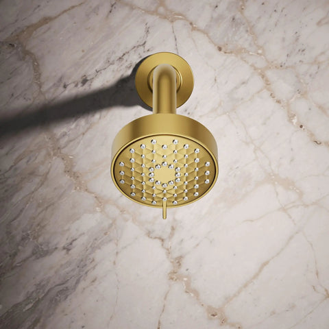 Awaken G90 Multifunction Showerhead With Three Spray Modes For Wide Coverage Intense Drench And Targeted Spray In A Dope Contemporary Geometric Design With Polished Chrome Finish Built For Everyday Spa Level Showers, in a gold finish, against a marble backdrop.