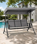 Gray three seat patio swing with adjustable tilt canopy, easy setup metal frame on stand by a poolside terrace