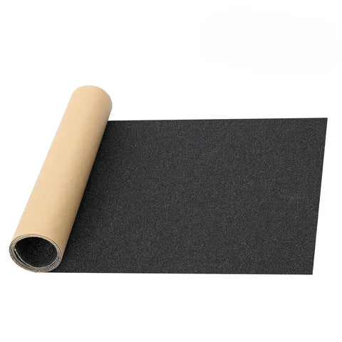 Grippy Grip Tape For Skateboards And Scooters 33 Inch By 9 Inch Black No Air Bubbles Durable Sandpaper Unrolled on White Background