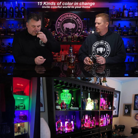 Two men tasting bourbon with Wireless Under Cabinet Lights Kit With 48 LED RGB Color Changing on shelves displaying bottles.