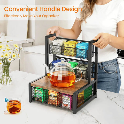 Industrial Rustic Tea Bag Organizer, 3 Tier Wood Storage Box With Drawer on countertop with glass teapot, woman holding handle