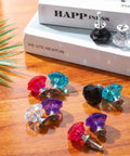 Colorful Crystal Cabinet Knobs Set 10 Pack 26mm Drawer Pulls in Five Dope Colors with aluminum backing on wooden table