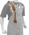 Canvas Bird Game Carrier For Waterfowl And Small Animals, with 12 waxed cord loops and cowhide leather trim, shown worn over shoulder.