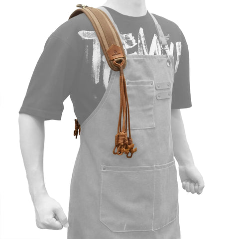 Canvas Bird Game Carrier For Waterfowl And Small Animals, with 12 waxed cord loops and cowhide leather trim, shown worn over shoulder.