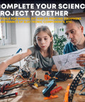 Father and daughter working on science project with electronic components and tools on a wooden table.