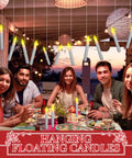 Group dining under hanging 108 Piece Flameless LED Taper Candles Set Battery Operated Flickering Candlesticks No Mess Easy Setup
