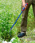 Person using Detachable Grass Sickle Folding Harvest Scythe Tool With Carbon Steel Blade and Anti Slip Rubber Handle