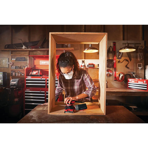 Person using Corded One Quarter Inch Sheet Sander With Thirteen Thousand Five Hundred OPM Pro Grade Two Amp Power on wood project