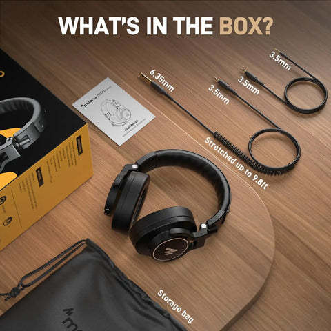 Studio Monitor DJ Headphones With 50mm Drivers Closed-Back Over-Ear Wired Headset For Music Production Recording Podcast Guitar Amp Or Keyboard 3.5mm To 6.35mm Jack MH700 Black with cables, manual, and storage bag on wooden surface