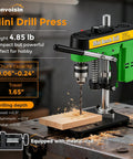 Steady As Can Be Benchtop Mini Drill Press With Quick Grip Vise drilling into wood, showing chuck and metal vise on a workbench.