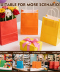 Kraft Gift Bags With Handles Bulk Pack 24 Small Party Favor Bags in 6 Colors, shown with flowers and gift box on table