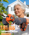 User trimming tree with Cordless Electric Pruning Shears With Dual Cutting Modes Up To 1.6 Inches in garden setting.