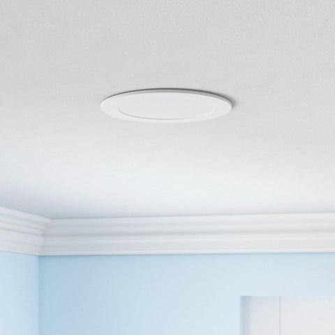 Ceiling with a Sixteen Pack 6 Inch LED Recessed Downlights Dimmable Easy Install 5 CCT 2700K to 5000K 1050 Lumens 12W fixture installed.