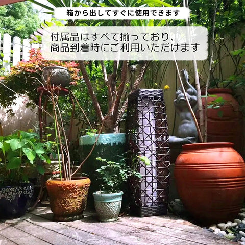 Solar Floor Lamp Outdoor Post Light with wicker resin lantern in a garden patio setting with potted plants, highlighting versatility.