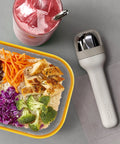 Pocket Utensil Set In Grey With 18/8 Stainless Steel Fork Knife And Spoon Nestled In A Compact Case on table with meal and drink