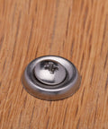 No. 10 stainless cup washer with countersunk finish, front view on wood surface.