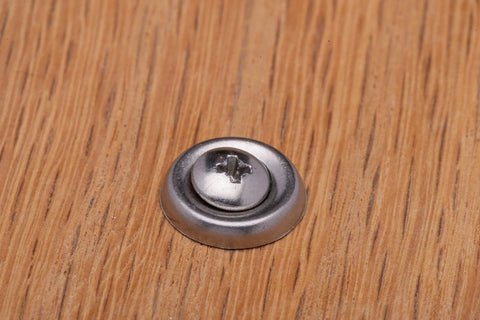 No. 10 stainless cup washer with countersunk finish, front view on wood surface.