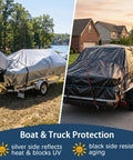 Heavy Duty 12x16 Foot Waterproof Poly Tarp With Grommets And Reinforced Edges covering boat and trailer outdoors, silver and black sides