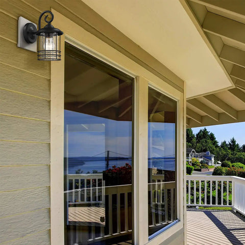 Slim 5.5 Inch Wide Outdoor Wall Light 2 Pack in Textured Black with Seedy Glass mounted near large porch windows