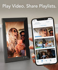 Lola 8 Inch Digital Picture Frame With No Fuss App And Email Sharing, black frame displaying family photo beside smartphone app