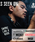 Man enjoying smoke with Mini Cannagar Mold And Cigar Roller Kit 1-2g Press, 30 Minute Burn Time, brand logos displayed as endorsements.