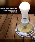 LED Smart Emergency Light Bulb With Rechargeable Battery Backup For 3 To 4 Hour Power Outages Perfect For Camping And Outdoor Use Handy Hook Four Pack on wooden base