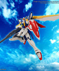 Wing Gundam Entry Grade 1 To 144 Scale Model Kit From Gundam Wing With All Signature Armaments soaring in sky with rifle