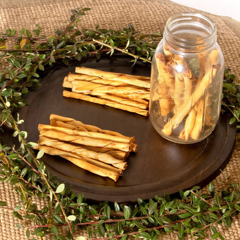 American Beefhide Twist Sticks For Dogs 5 Inch Rawhide Dental Chews With Chicken Flavor in jar and on tray