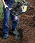 Man using Beast 72cc Gas Powered Post Hole Digger With 4.1HP Heavy Duty Earth Auger on soil