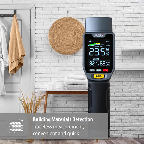 Six In One Pinless Moisture Meter For Drywall And More, Noninvasive Humidity Sensor With Gypsum Cement Board Cork Hardwood Mildew Index, Surface Safe, No Pinholes Or Scratches, Fast Accurate Readouts shown beside a brick wall