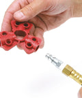 Quick Disconnect Pneumatic Lockout System for Lockout Tagout shown in hand with fitting ready for attachment.
