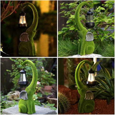 Super Cool Outdoor Elephant Garden Statue Resin With Solar Light For Yard Patio Balcony And Lawn Decor Friendly Grey Tone Happy Face Trunk Up Brings Good Luck Vibes Perfect For Fathers Day Gifts Ornament Figurine Fifteen Inches shown lit at night.