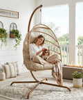 Outdoor Egg Chair With Stand For Patio Backyard Hanging Swing Chair With Foldable Rattan UV Resistant Padded Cushion 350 Lb Capacity Beige Cozy And Chill