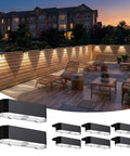 Solid Solar Fence Lights Outdoor Deck Waterproof Warm White Glow 8 Pack mounted on a wooden deck, enhancing evening ambience.