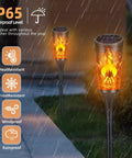 Super Cool Solar Torch Lights Outdoor Six Pack With Realistic Dancing Flickering Flames Super Waterproof Design in rain