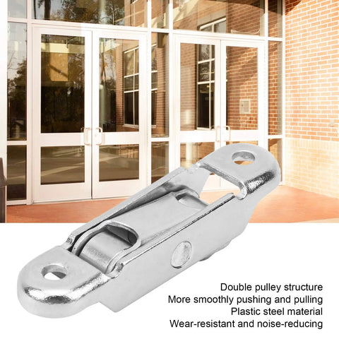 20Pcs Slick Sliding Window Track Rollers for PVC Doors and Windows near double door entrance, showcasing sturdy plastic design.