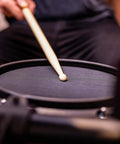 Close-up of drumstick hitting mesh pad on Turbo Mesh Kit Electric Drum Set With 100 Plus Sounds Dope Quiet Mesh Pads Sticks And Cables