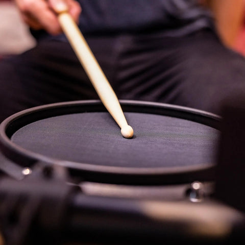 Close-up of drumstick hitting mesh pad on Turbo Mesh Kit Electric Drum Set With 100 Plus Sounds Dope Quiet Mesh Pads Sticks And Cables
