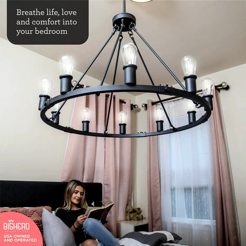 Dope Large Wagon Wheel Chandelier With Ten Lights In Black Rustic Farmhouse Pendant Lighting hanging in a cozy bedroom