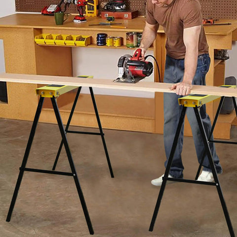 Rock Solid Portable Folding Sawhorse Heavy Duty Steel Work Stand Twin Pack With Anti Slip Eva Work Surface And Built In Carry Handle For Tradesmen And Diy Crafters Quick Fold Design being used for cutting wood.