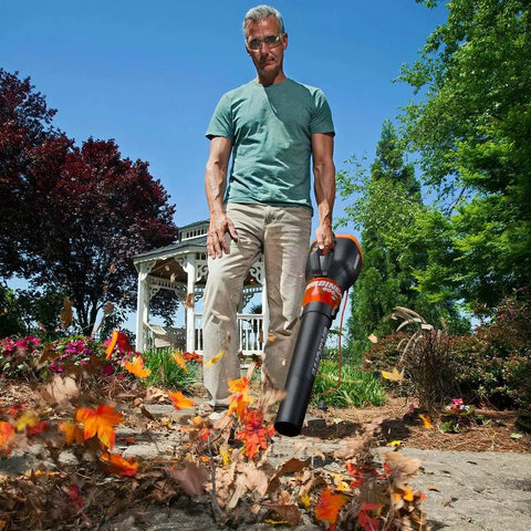 Man using 12 Amp Electric Leaf Blower With Turbine Tech For Lightning Fast Yard Cleanups 600 CFM 2 Speed Control Corded Power WG520