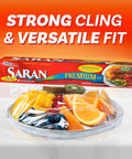 Ridiculously Handy Clear Plastic Wrap For Kitchen Storage in packaging next to plate with fruit, demonstrating tight cling