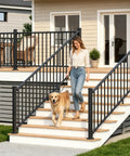 No Sweat Diy Black Aluminum Deck Railing Kit With Clip On Installation Heavy Duty 36 Inch High 8 Foot Wide Outdoor Porch Fence Panels For Backyard Privacy And Style with a woman and dog on steps.