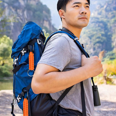 Hiker with backpack featuring Two Pack Paracord Keychain Hook With Carabiner Clip And Orange Braided Strap Locking D Ring Key Ring Holder