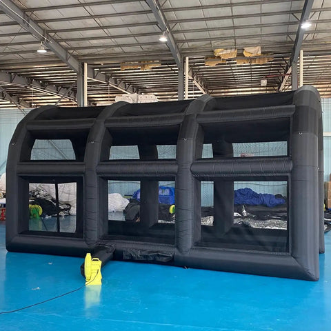 Inflatable Tennis Court Style Tent And Baseball Batting Cage With Blower Portable 19.68 Ft By 9.84 Ft in a warehouse setup
