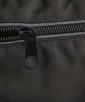 Close-up view of a zipper with a black plastic slider from the Zipper Puller Replacement Kit 32 Pieces In Four Sizes Quick Fix Zipper Slider Set For Coats Jackets